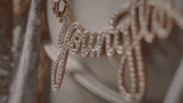 a close up of a necklace that says ' emporio ' on it