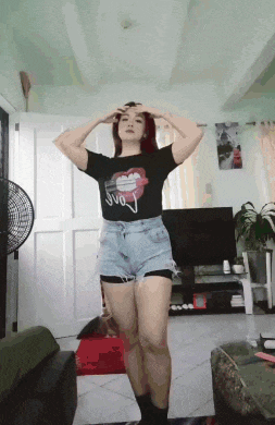 a woman wearing a black shirt that says love