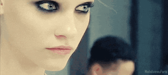 a close up of a woman 's face with the words modeavenuefans written on the bottom