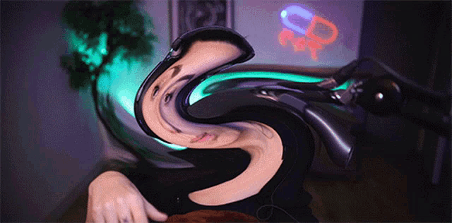 a person 's face is twisted into a swirl in front of a sign that says cd on it