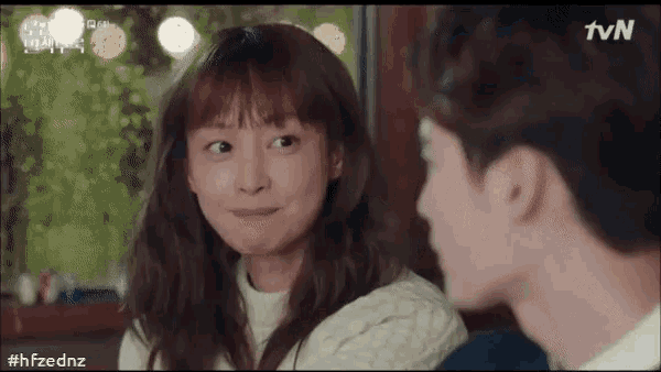 a man and a woman are looking at each other with the tvn logo in the corner