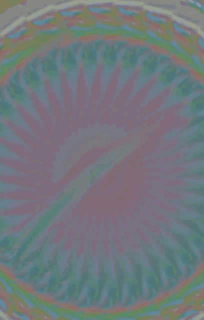 a colorful background with a circular pattern and a purple center