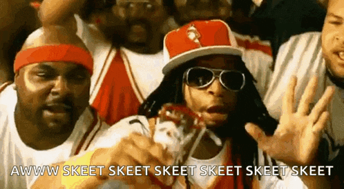 a man wearing sunglasses and a hat is surrounded by other men and says awww skeet skeet