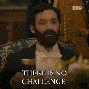 a man in a tuxedo with a beard is holding a glass and says you are not equal to my dear