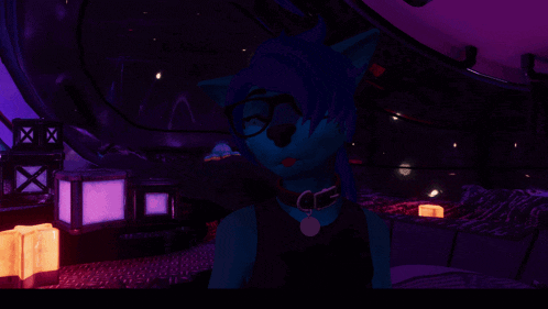 a close up of a blue object with a purple eye in a dark room