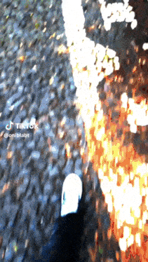 a person 's foot is visible in a blurry photo that says tiktok