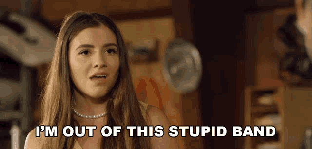 a girl with long hair says i 'm out of this stupid band