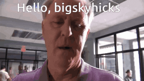 a man in a purple shirt is saying hello bigskyhicks