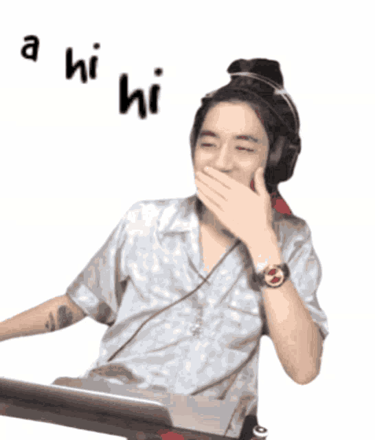 a man wearing headphones covering his mouth with his hand and the words " a hi hi " written above him