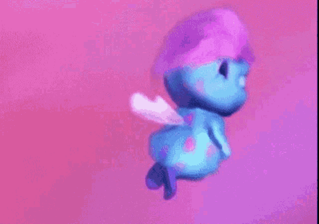 a blue cartoon character with a purple hat and wings is flying in the air