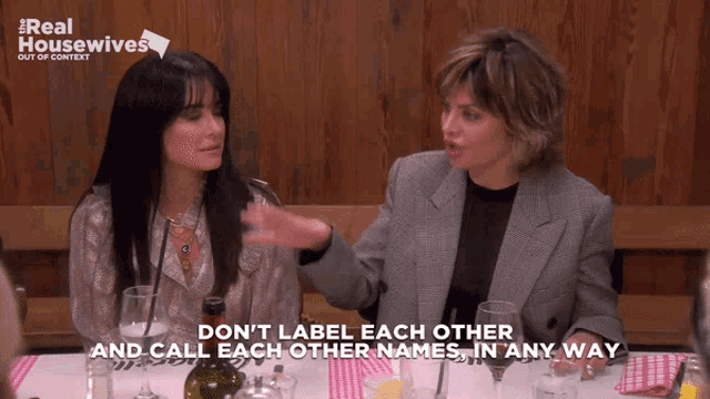 two women sitting at a table with the words " do n't label each other and call each other names "
