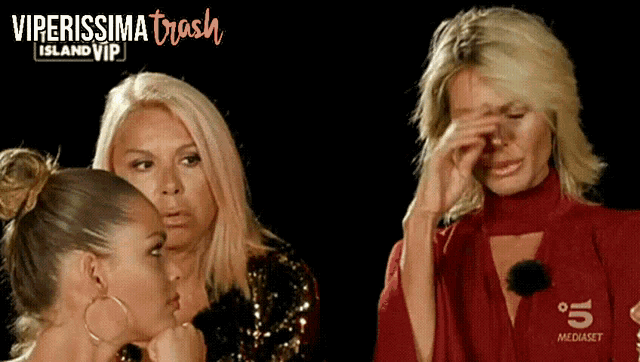 three women are sitting in front of a screen that says " viperissima trash island vip "