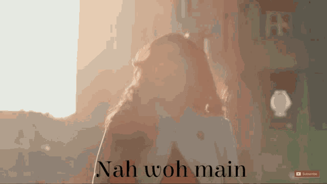 a woman is standing in front of a window with the words nah woh main on the bottom