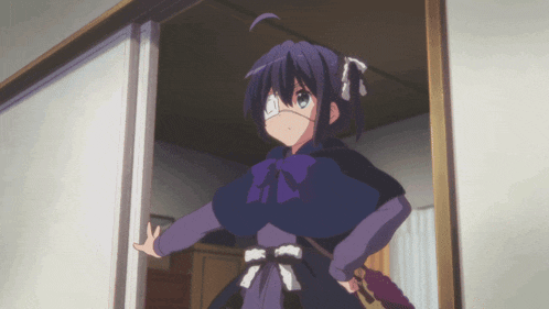a girl in a purple dress is standing in a room