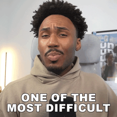a man in a hoodie says one of the most difficult in white letters