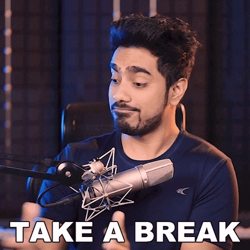a man in front of a microphone with the words take a break below him