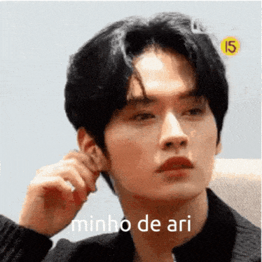 a close up of a person 's face with the words minho de ari on it