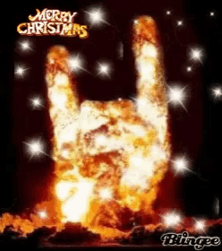 a merry christmas greeting card with a hand made out of flames