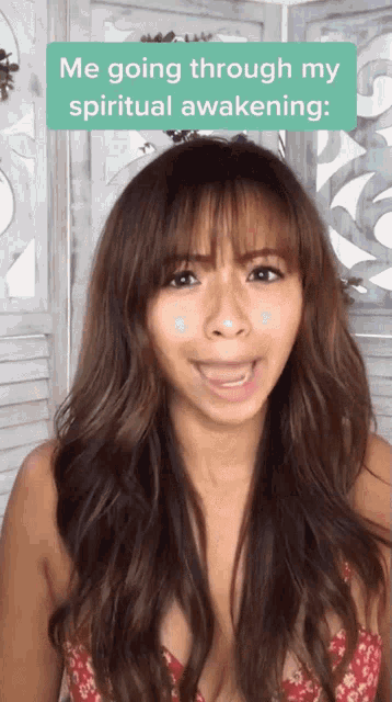 a woman in a red top is talking about spiritual awakening