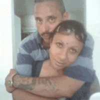 a man and a woman are posing for a picture together .