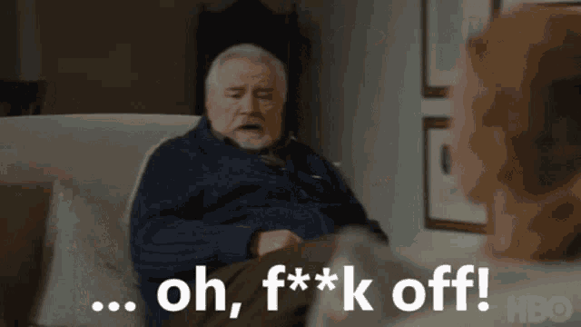 an older man is sitting on a couch talking to a woman and says oh , f * * k off !