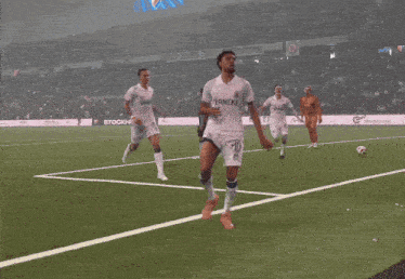 a soccer player wearing a white jersey that says ferneke on it