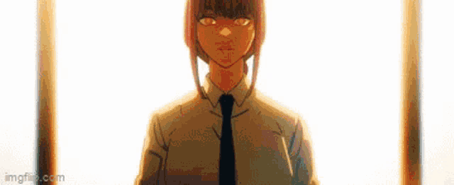 a close up of a person wearing a tie and a shirt .