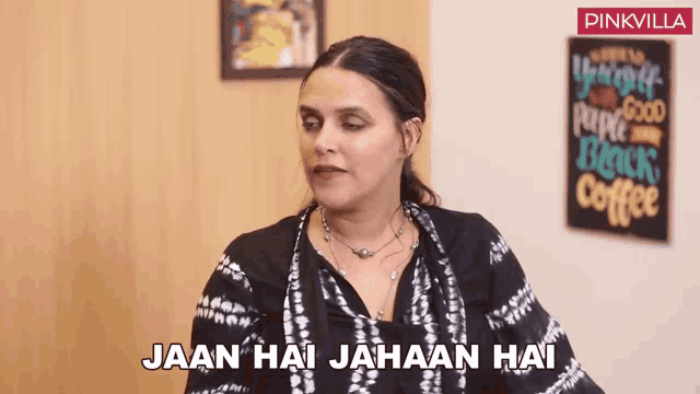 a woman says " jaan hai jahaan hai " in front of a sign that says black coffee