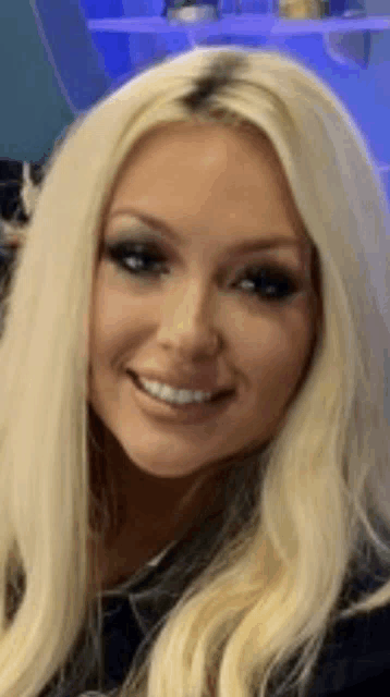 a close up of a woman 's face with blonde hair