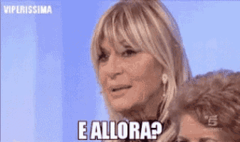 a woman is making a funny face and asking e allora ?