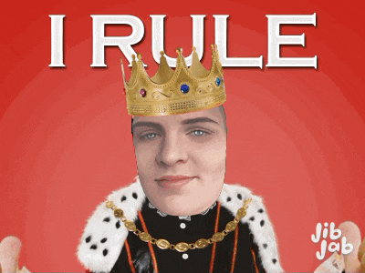 a man wearing a crown and a king 's robe with the words i rule above him