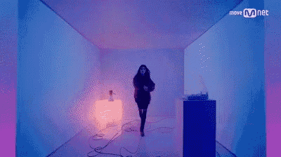 a woman in a red sweater is standing in a room with the words move mnet written on the bottom