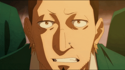 a close up of a man 's face with a nose piercing