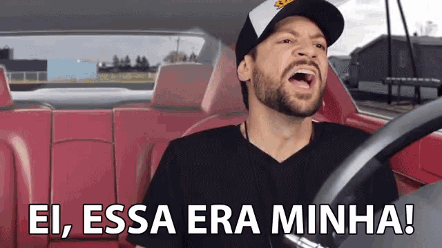 a man in a car with the words ei essa era minha written on the bottom