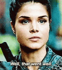 a woman is holding a sword and says well that went well