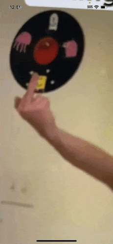 a person is pointing at a record that says 12:51
