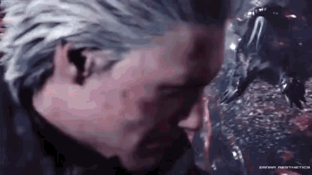 a close up of a man 's face in a video game with blood coming out of his eyes .
