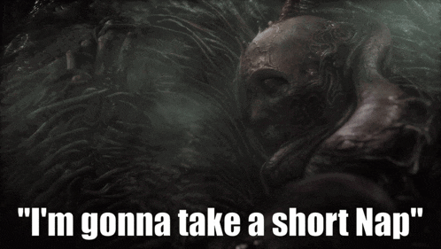 a statue with the words " i 'm gonna take a short nap " written below it