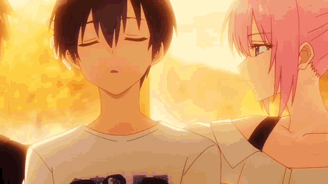 a boy and a girl are standing next to each other with their eyes closed .