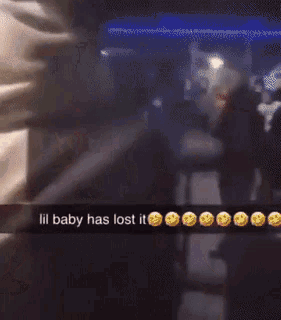 a blurry picture of a person with the words lil baby has lost it