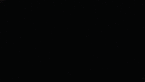 a close up of a cartoon eye with red lights coming out of it