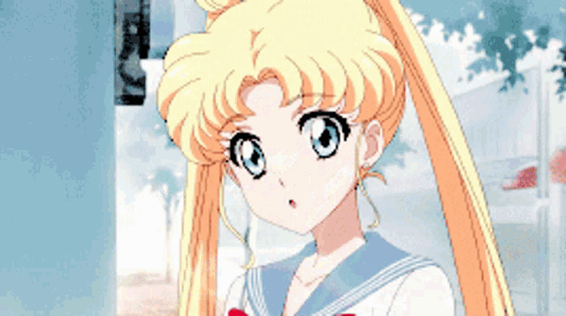 a girl with blonde hair is wearing a sailor suit