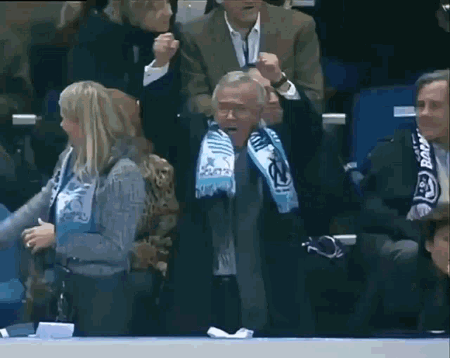 a man with a scarf around his neck that says ' barcelona '