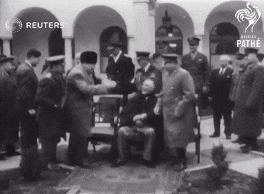 a group of men are shaking hands in front of a building that says reuters on the top