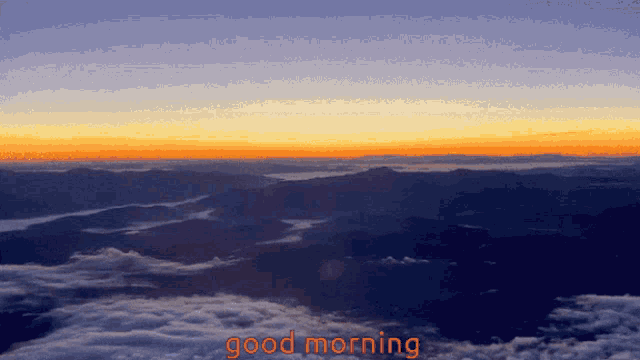 an aerial view of mountains and clouds with the words good morning