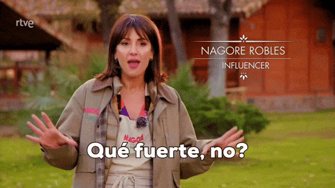 a woman is standing in front of a sign that says nagore robles