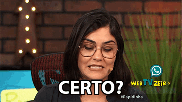 a woman wearing glasses and a microphone has the word certo on her face
