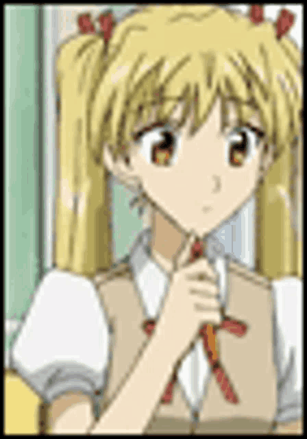 a girl with blonde hair and pigtails is sitting in a chair and holding a red bow .