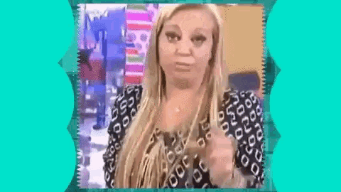 a woman in a leopard print shirt is making a face