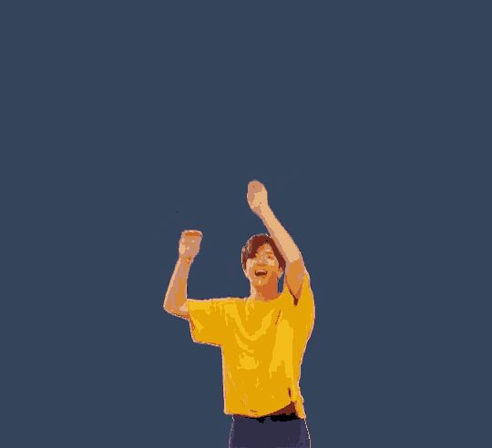 a man in a yellow shirt and purple shorts is dancing against a blue background .